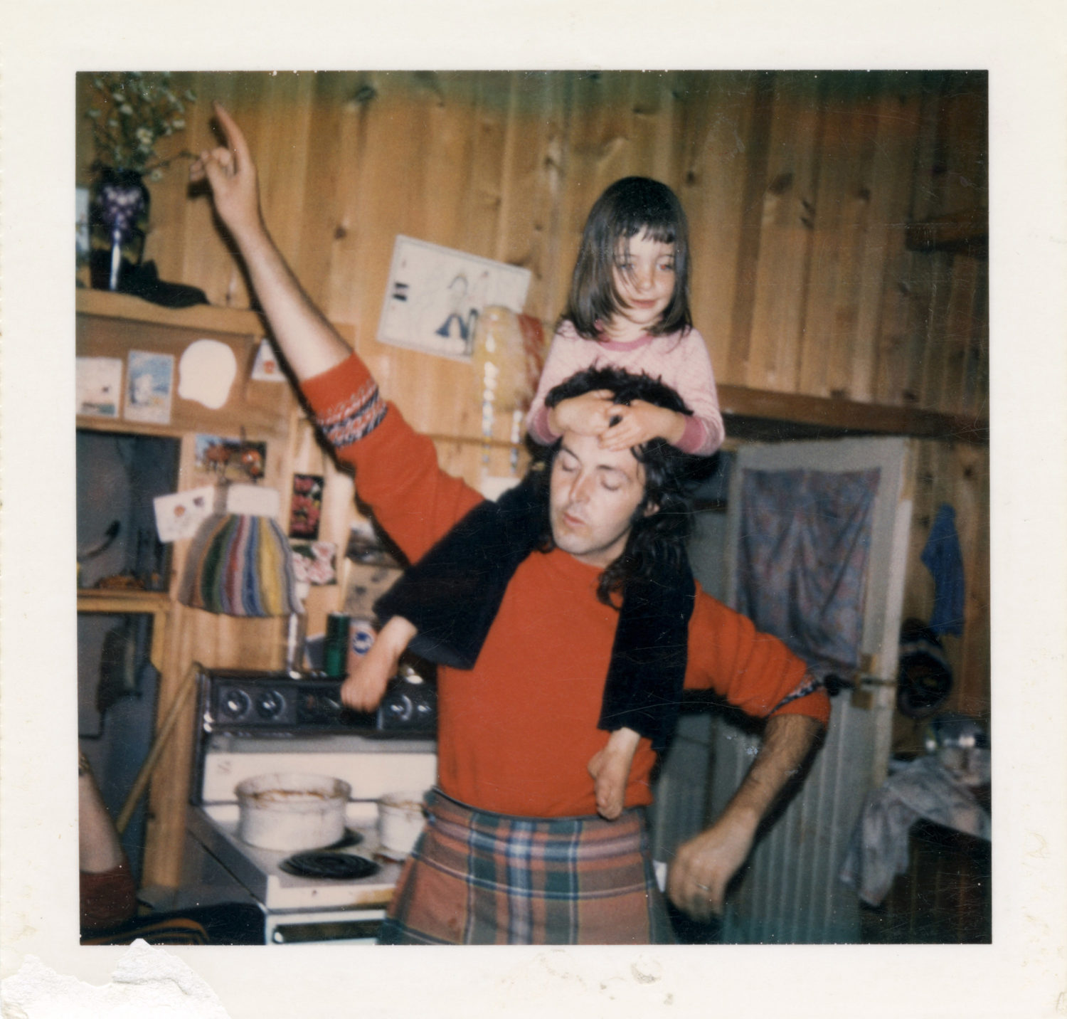 Polaroid of Mary on Paul's shoulders