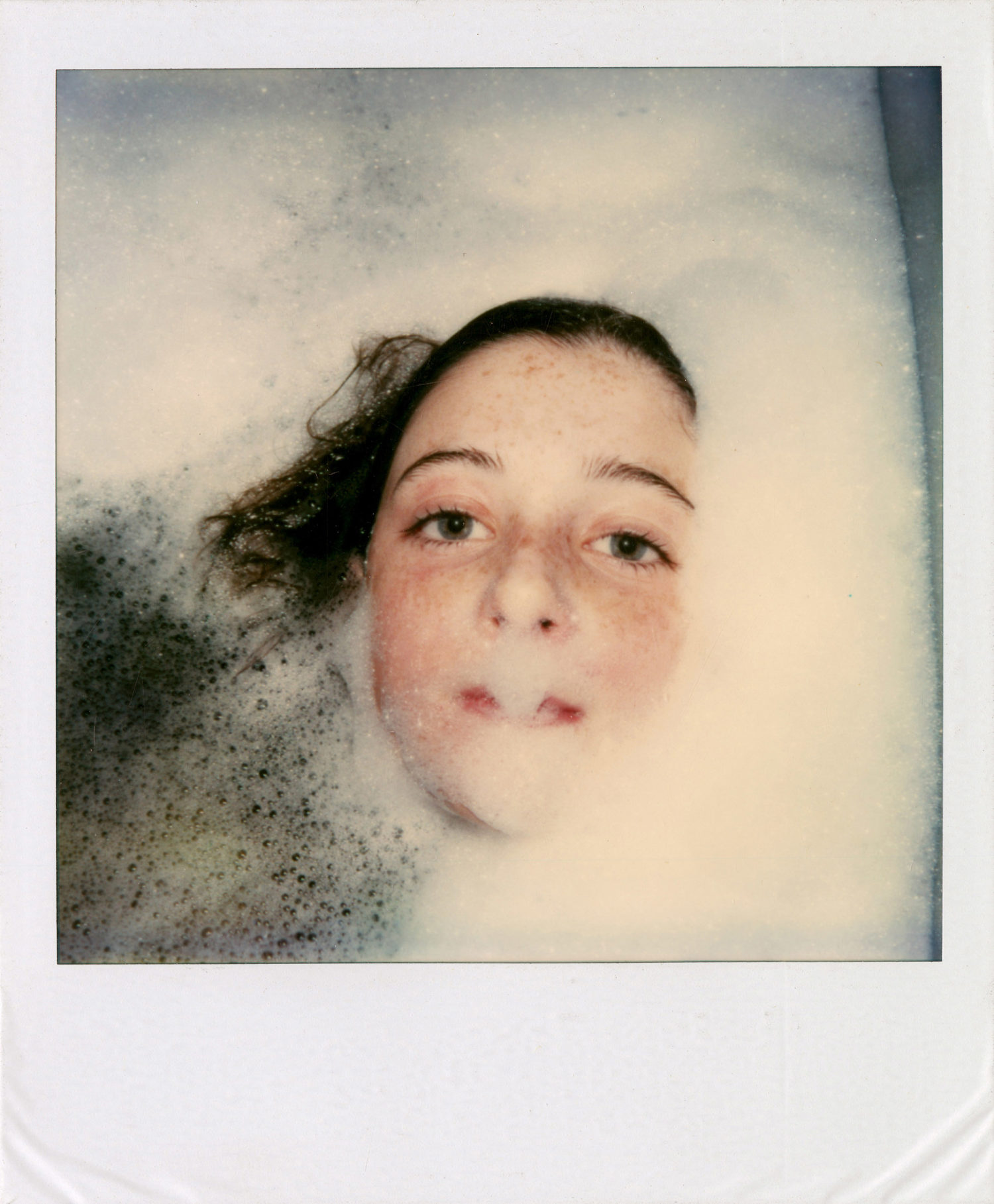 Polaroid of Mary in the bath