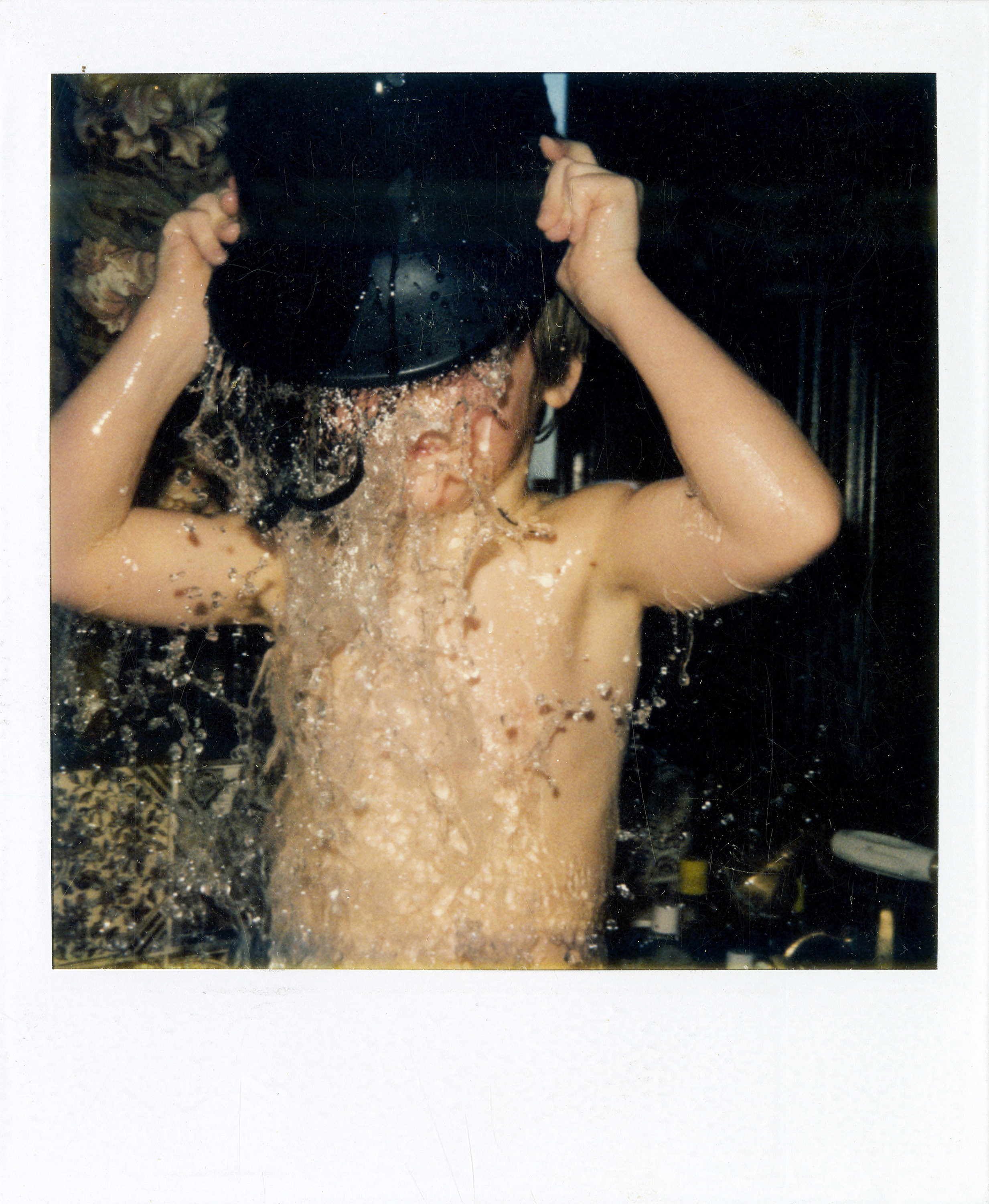 Polaroid of James with bucket.